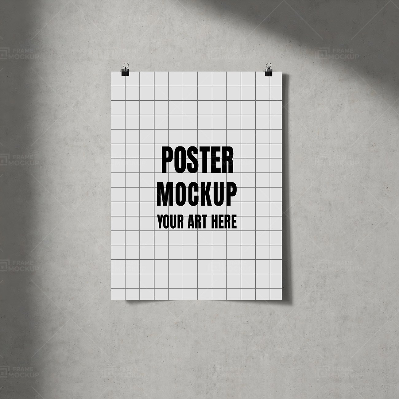 Poster mockup PSD featuring a blank white sheet hanging from black clips on a concrete wall.