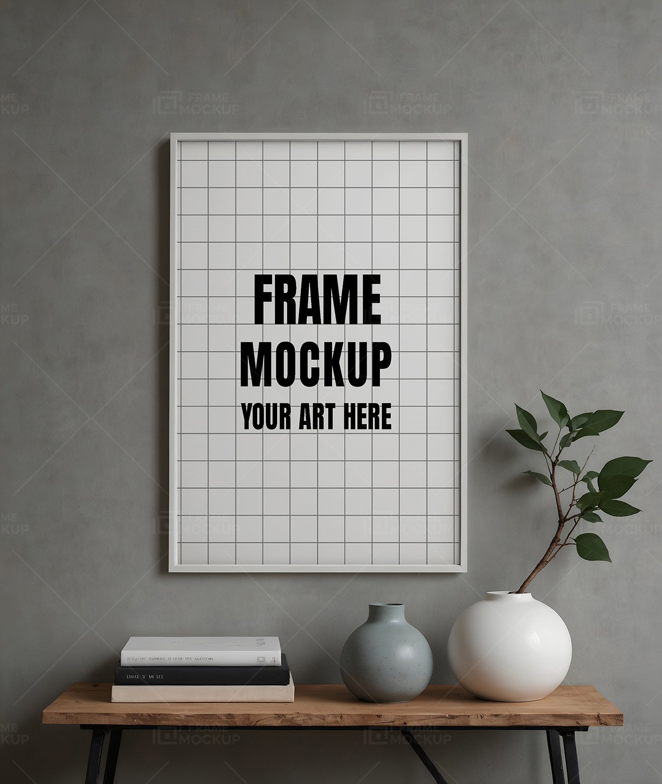 Frame mockup PSD showcasing a white-framed artwork with a grid design displayed on a gray wall, alongside a table with decorative vases and stacked books.