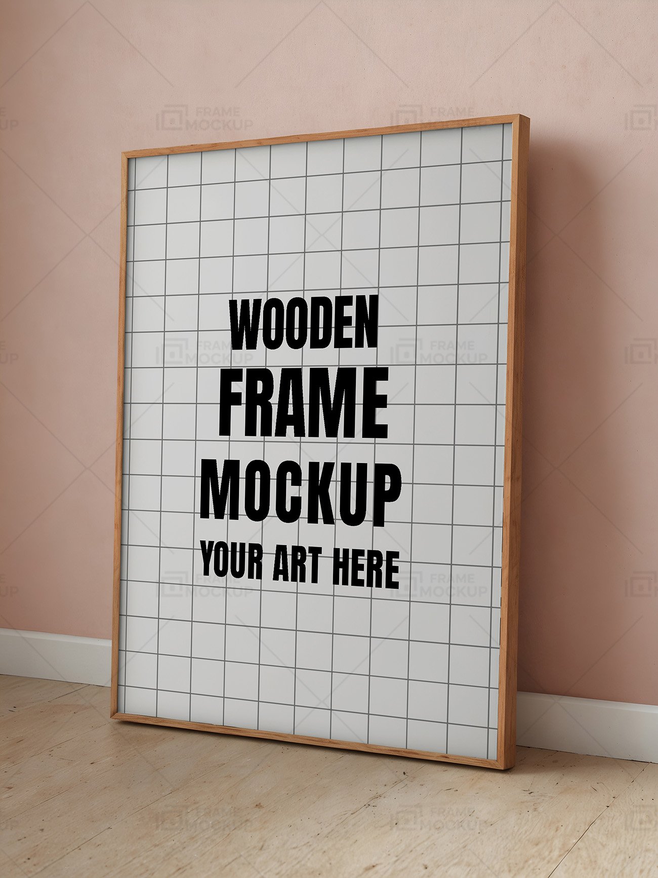 A wooden frame mockup with a blank interior leaning against a soft pink wall, on a wooden floor.