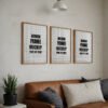 Three wooden frame mockups with blank interiors displayed on a wall above a brown leather sofa, accompanied by decorative pillows and a potted plant.