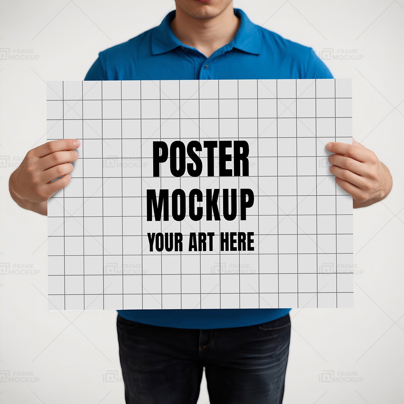 A person in a blue polo shirt holding a blank white poster board in front of a light gray background.