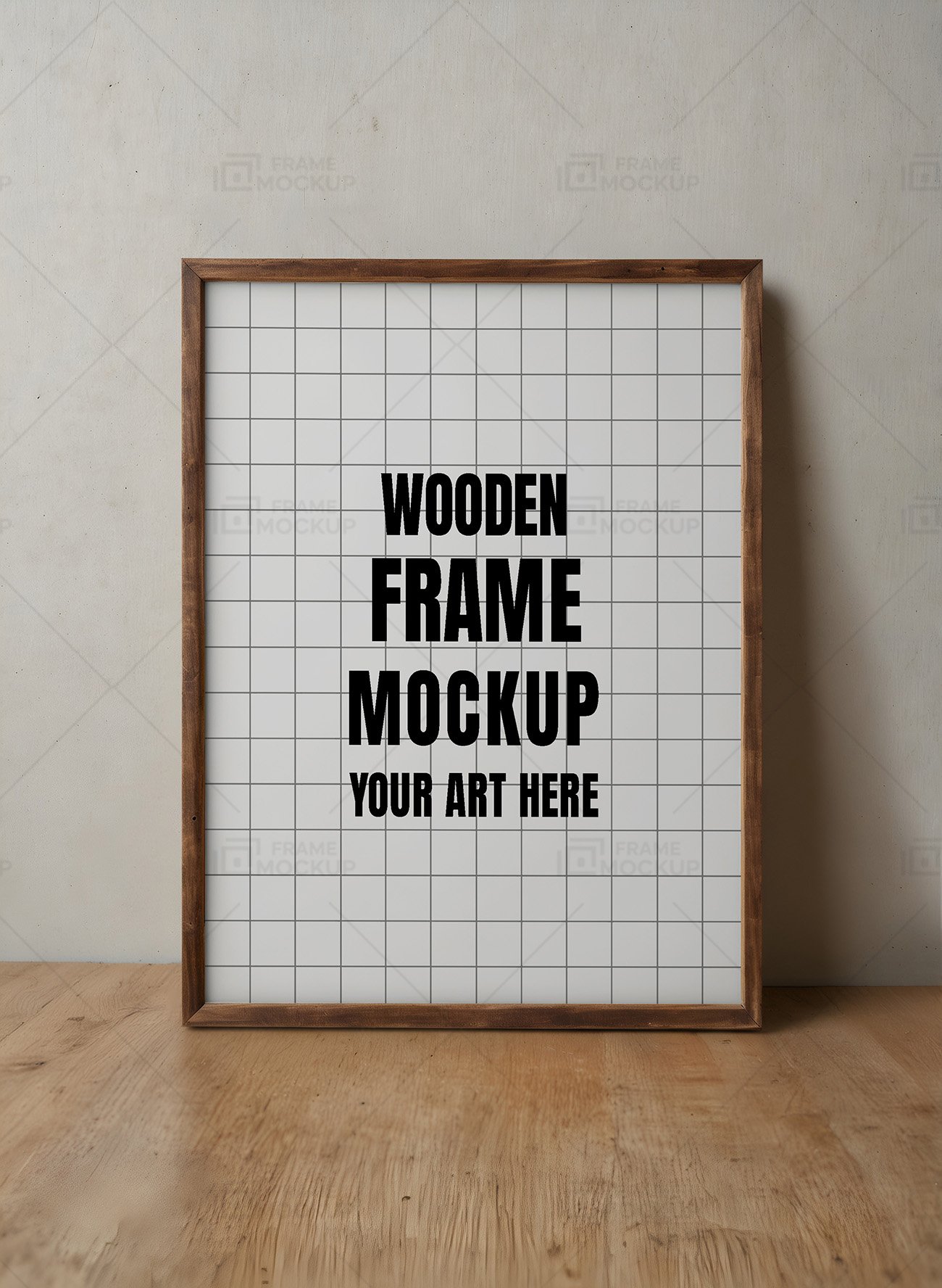 A wooden frame mockup with a blank canvas resting on a wooden table against a textured gray wall.